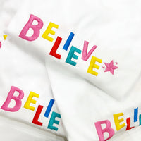 ‘BELIEVE’ Tee